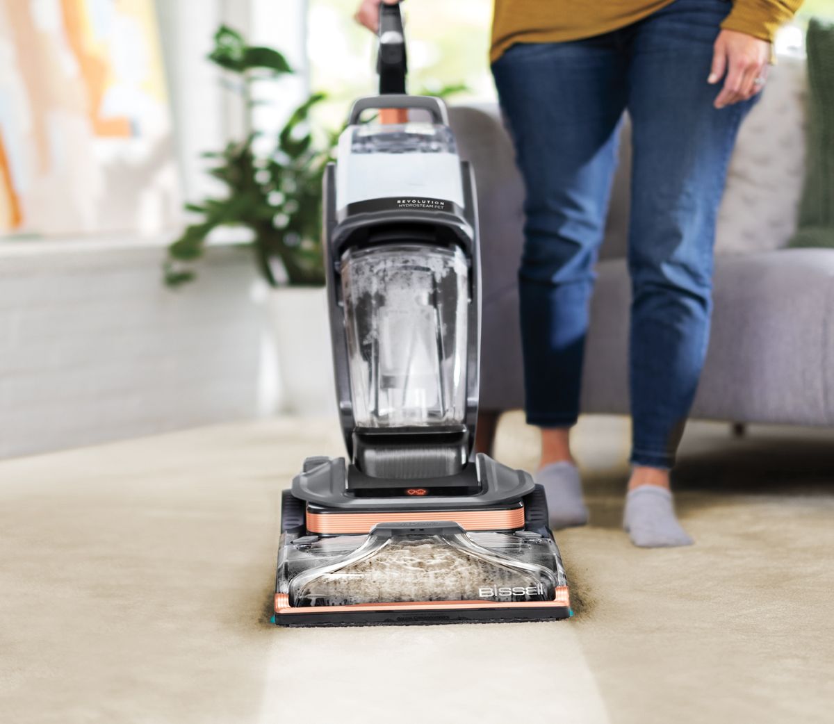 Bissell Revolution HydroSteam Pet cleaning carpet in a living room