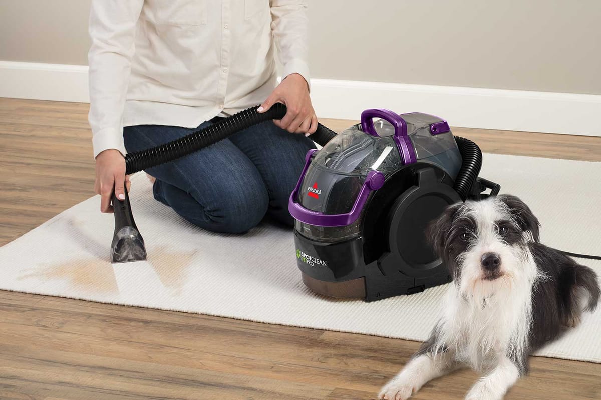 Bissell SpotClean Pet Pro cleaning a pet stain on a rug