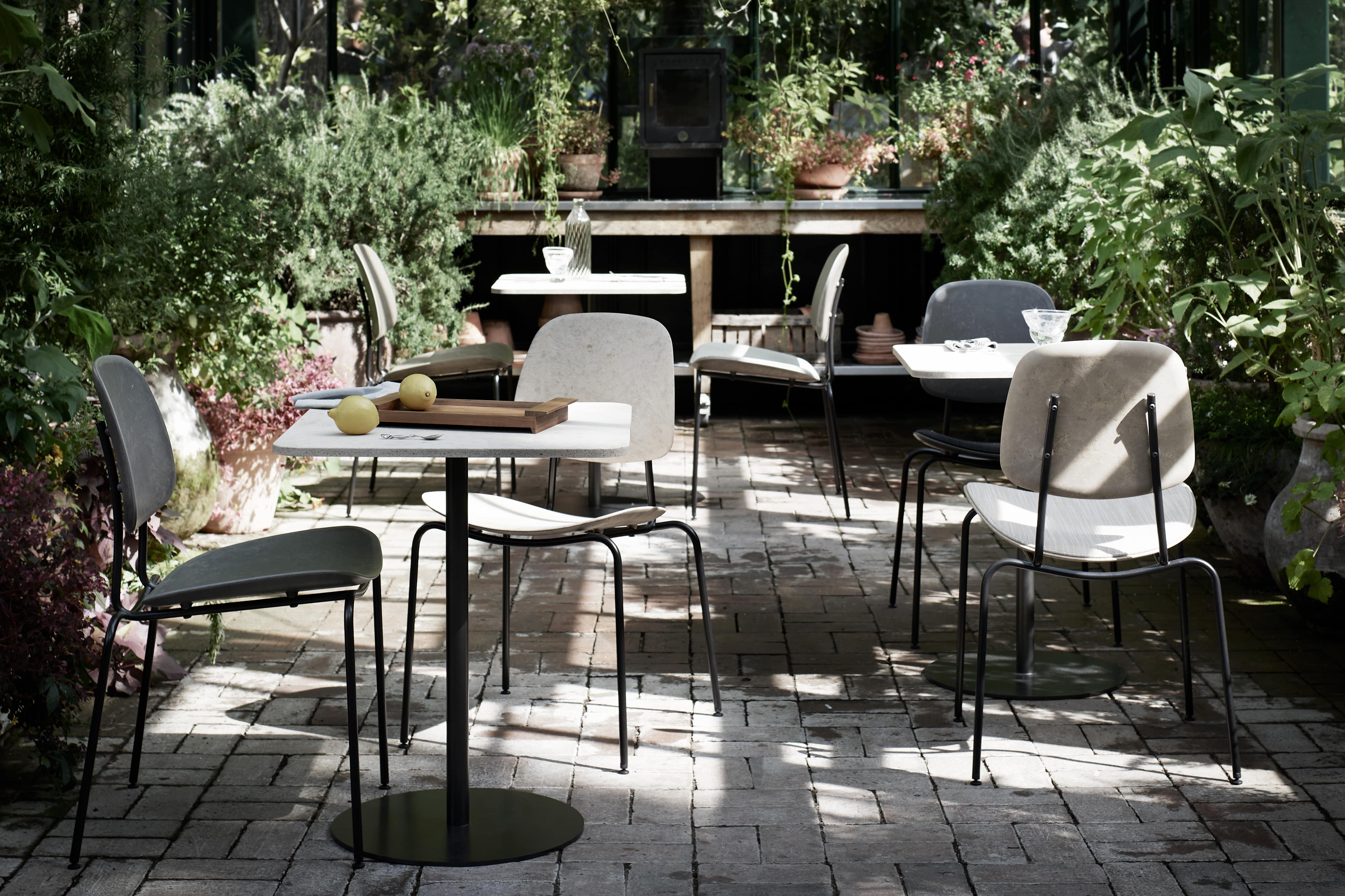 Mater dining furniture in a furnished room setting